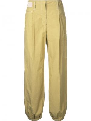 Расклешенные брюки Lemaire. Цвет: жёлтый и оранжевый