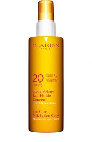 Солнцезащитное молочко-спрей для лица и тела SPF 20 Spray Solaire Lait-Fluide Clarins. Цвет: бесцветный