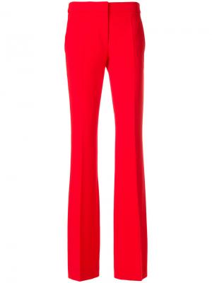 Расклешенные брюки Moschino. Цвет: красный