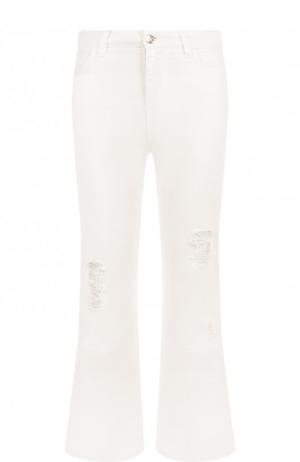 Укороченные расклешенные джинсы с потертостями Dolce & Gabbana. Цвет: белый